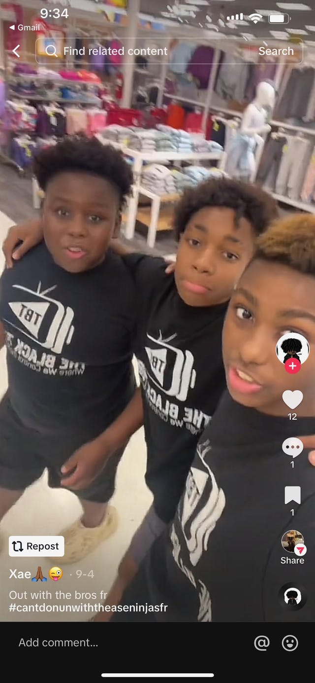 3 young boys wearing TBT t-shirt
